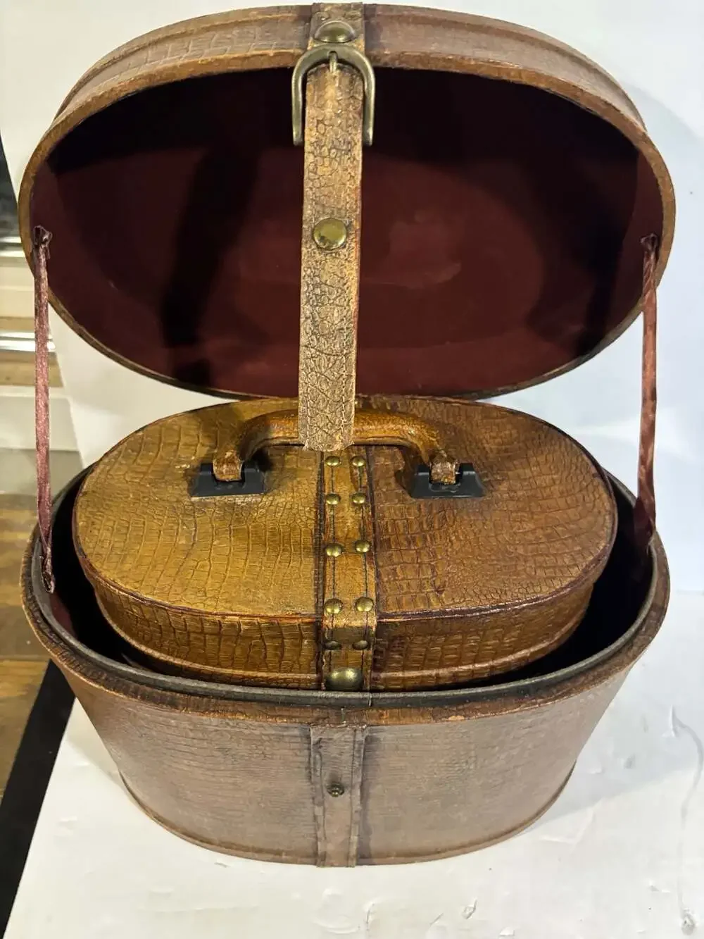 Vintage Oval Leather Hat Box with Brass Buckle and Burgundy Lining